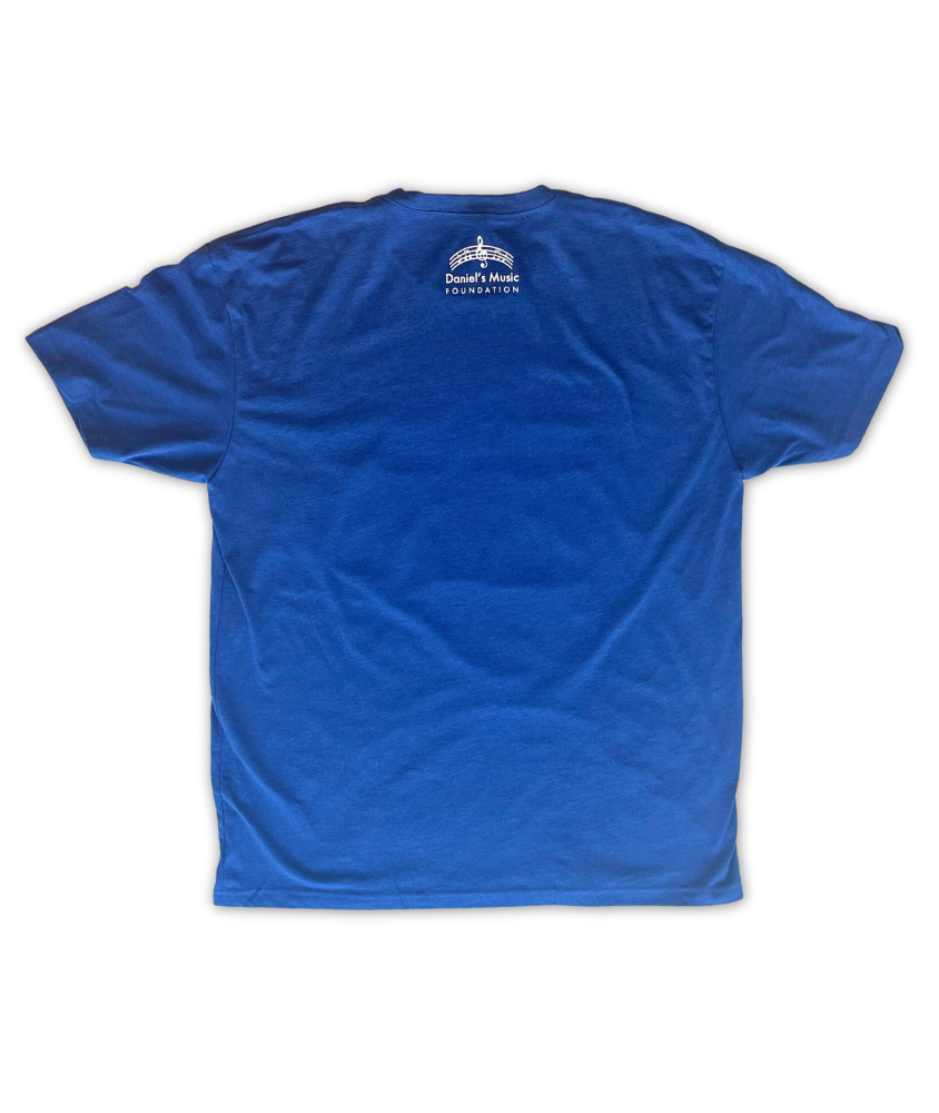 Rear image of a blue t shirt with the old Daniel's Music Logo on the back, featuring an arced music ledger line around a large treble clef